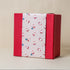 Red Gift Box with Pink Happy Santa Sleeve
